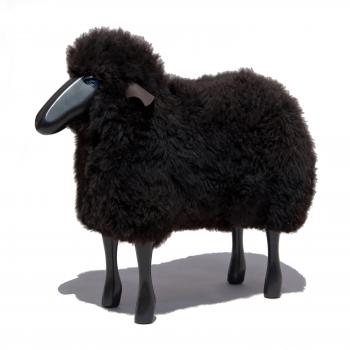 Schaf, klein, gelocktes braunes Fell, schwarzes Holz
